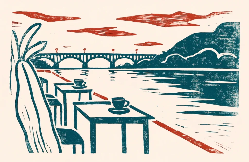 Illustrasjon av kafébord med kaffe ved elvepromenaden og en bru i bakgrunnen